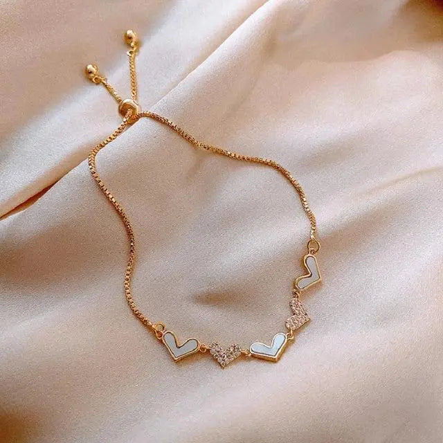 Regulowana złota bransoletka z sercem