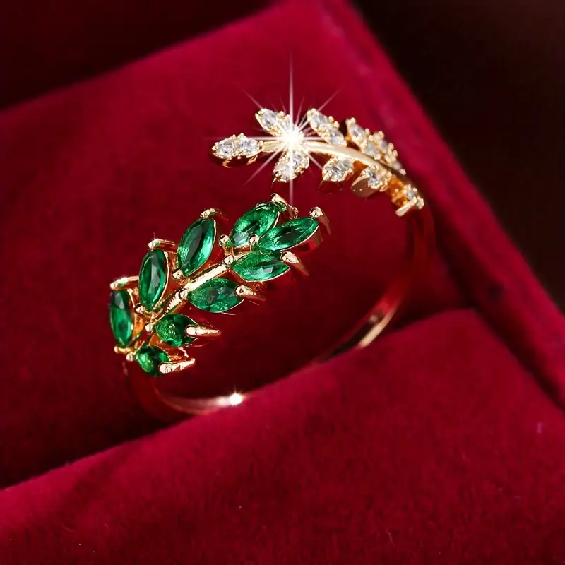 Otwarte pierścionek z zielonym cyrkoniami w kształcie liści